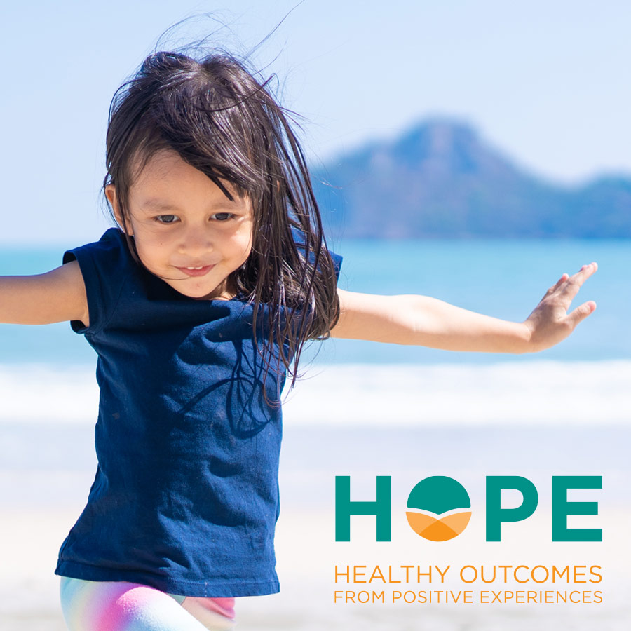 Tufts Hope Logo - Teal and orange sans-serif type with stylized letter O in Hope over photo of little girl twirling on the beach