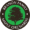 Branon Family Maple Orchards Icon - White sans-serif type inside black circle with tree and green background