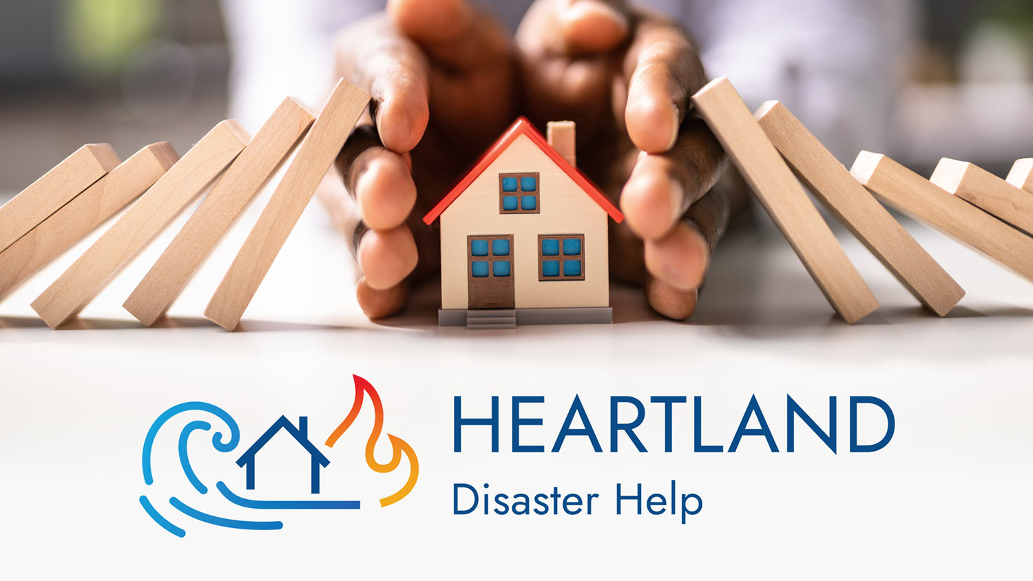 Photo of a person protecting a little wooden house from wood dominoes falling on it with the Heartland Disaster Help logo below
